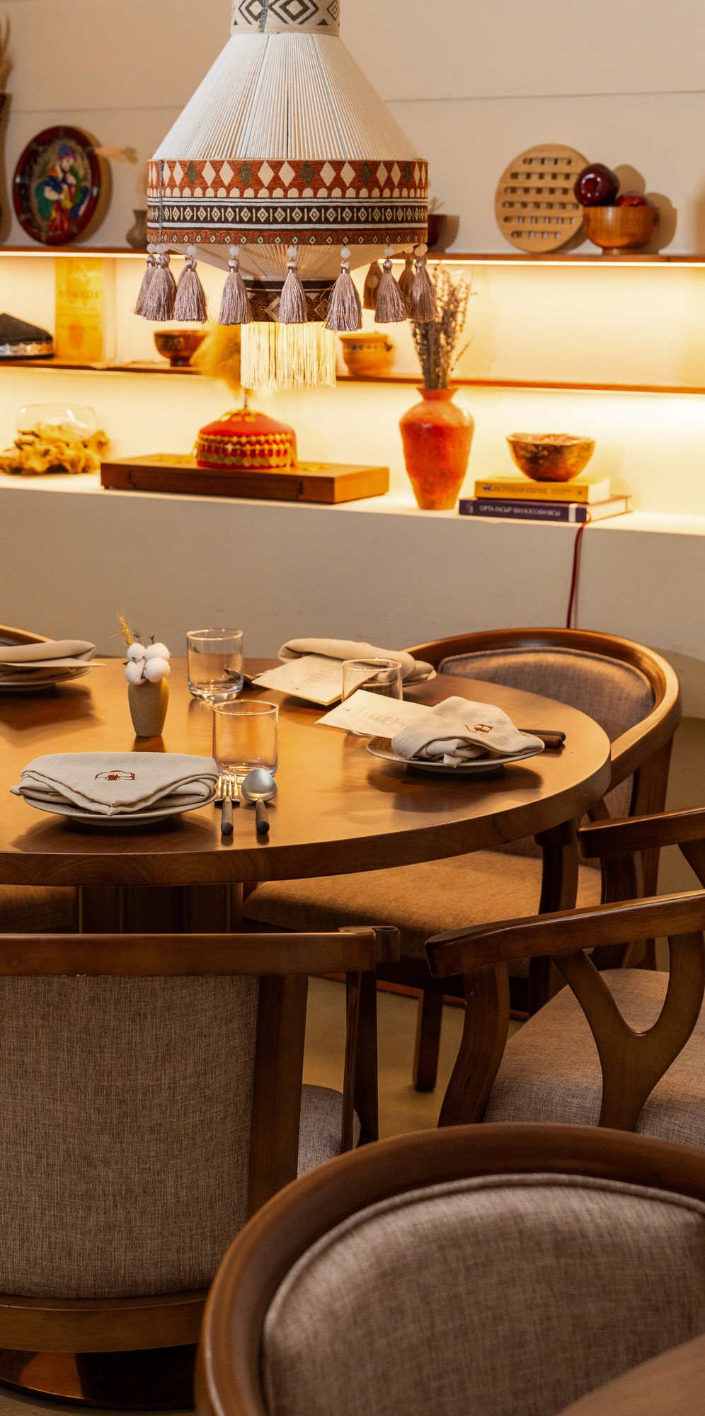 Inside YURT: set tables under a woven lampshade